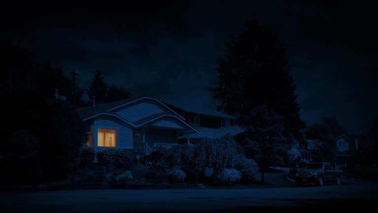 man turns on light and walks past in house at night 2