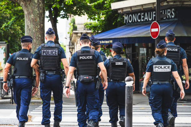 uniformed police officers patrol on foot and provide securit 8