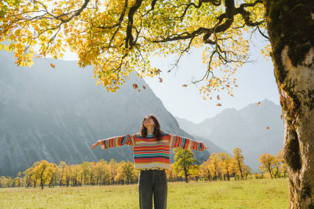 woman enjoys autumn landscape in alps 6