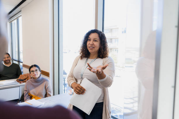 professor leading engaging discussion with students in classroom2198009069